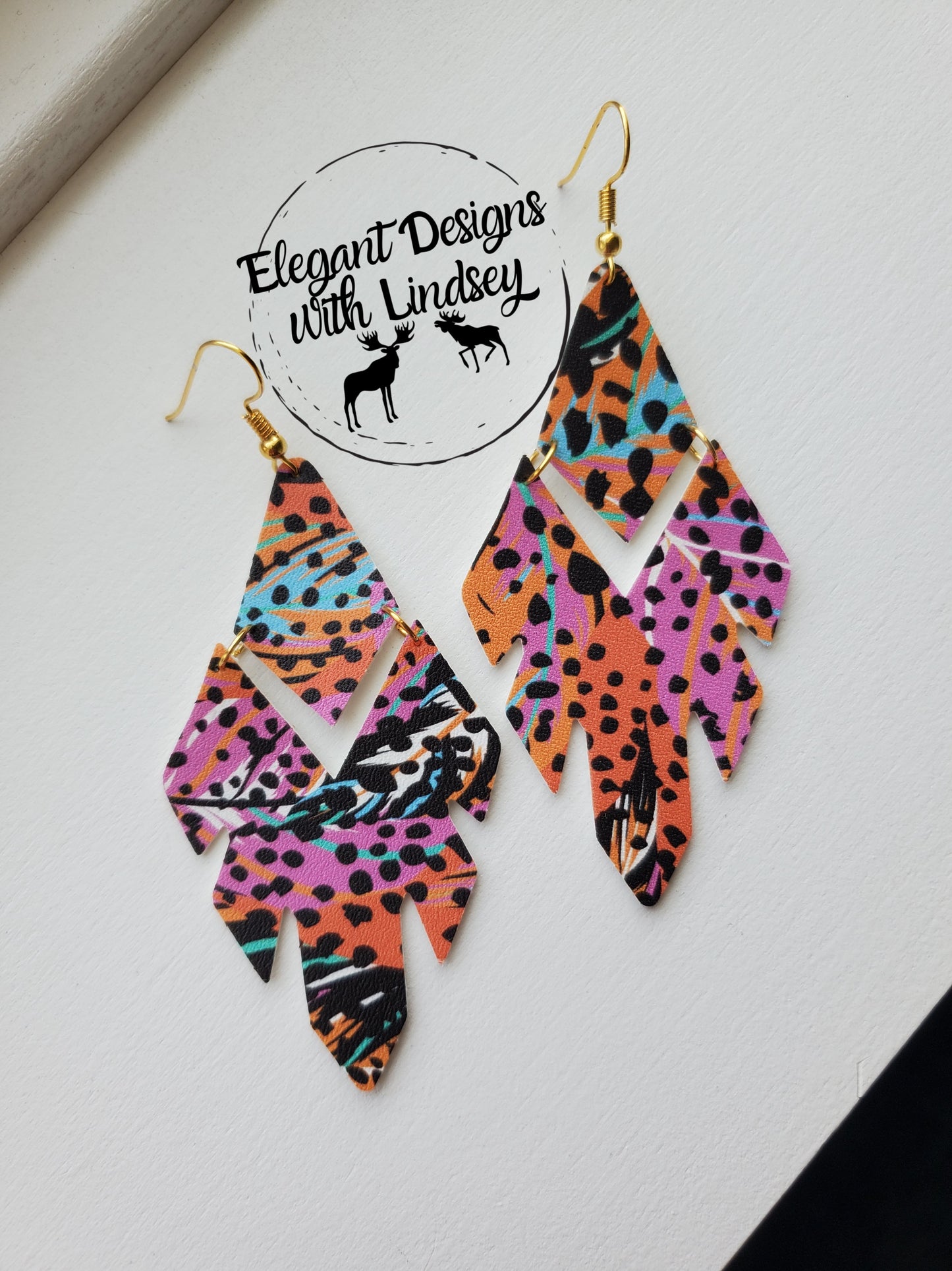 Feather tribal double tiered faux leather earrings