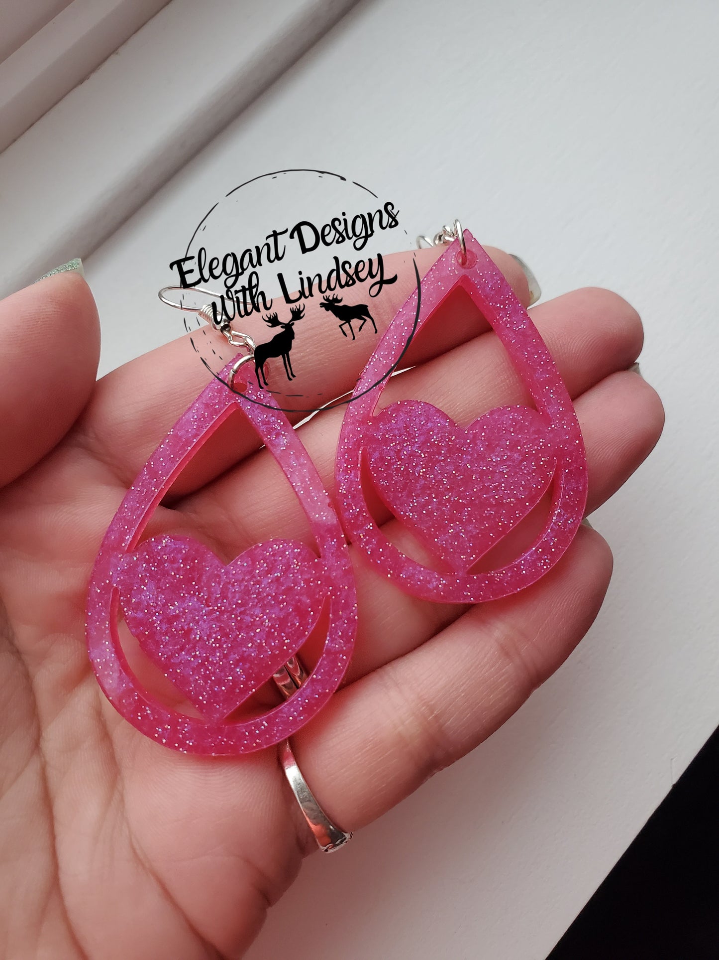Pink glitter heart resin earrings